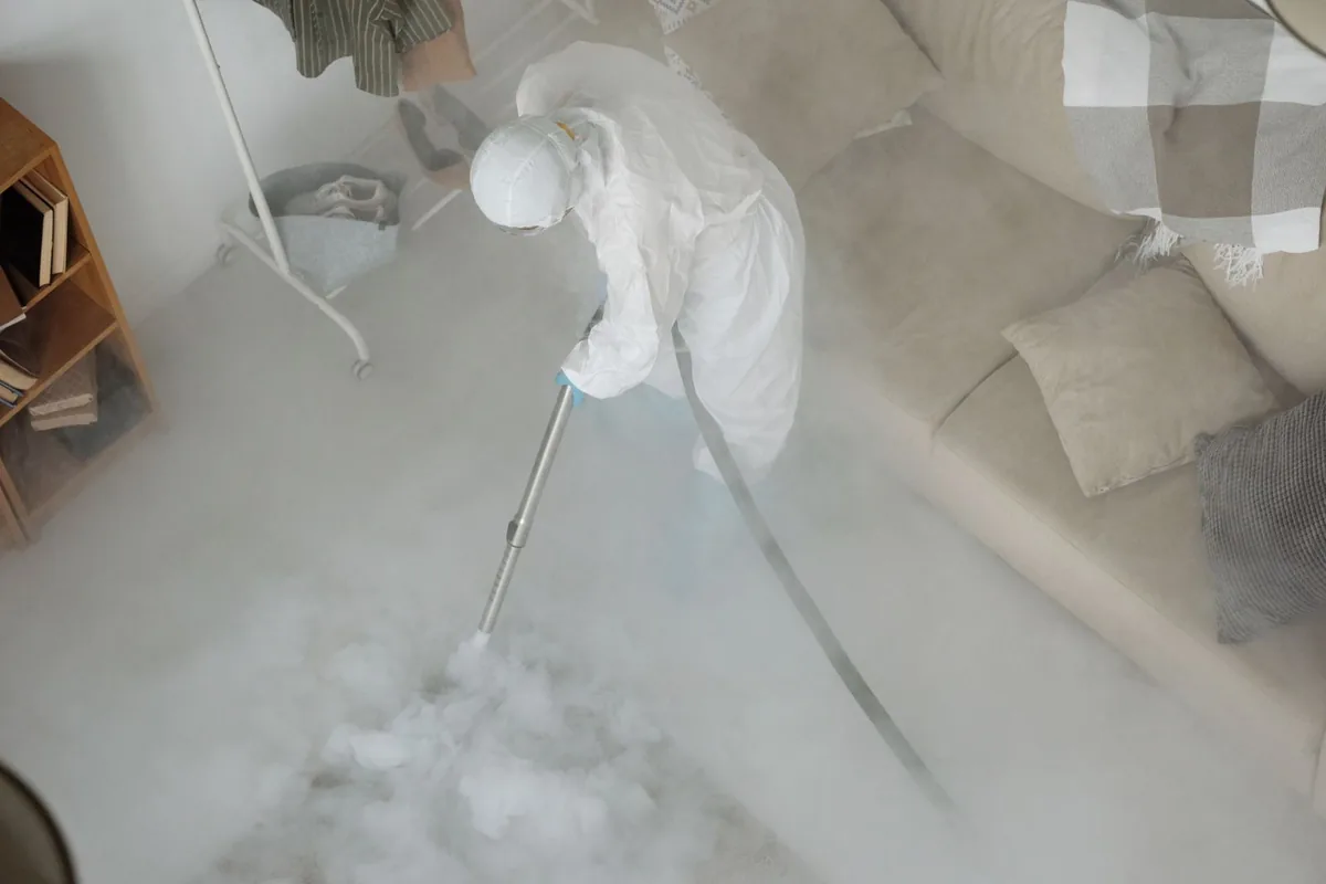Biohazard cleanup technician in protective equipment, Belle Mead, NJ